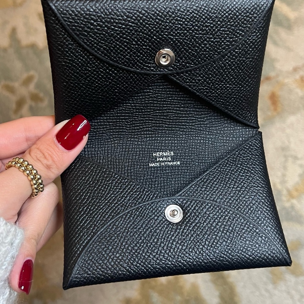BNIB Hermes black calvi cardholder with Hermes orange box that comes with it!